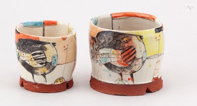 Lot 202 - BEDE CLARKE; a slipware cup decorated with a...