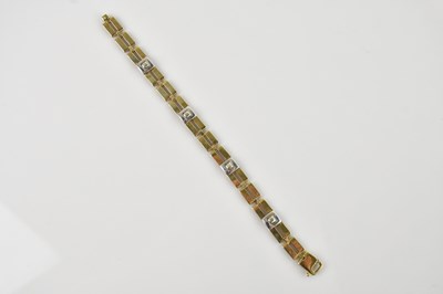 Lot 524 - A 9ct yellow and white gold bracelet, length...