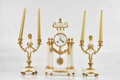 Lot 264 - A decorative marble and gilt three piece clock...