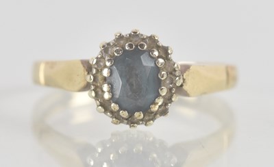 Lot 1220 - A 9ct yellow gold aquamarine and diamond set...