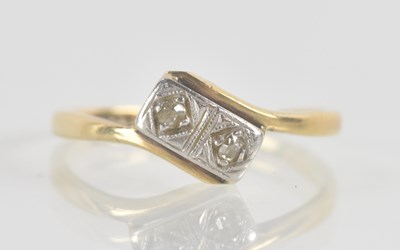 Lot 1230 - An 18ct yellow gold and platinum two stone...