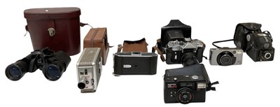 Lot 385 - Six cased vintage cameras including Kodak...