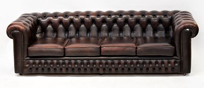 Lot 33 - CHESTERFIELD; a dark brown leather button...