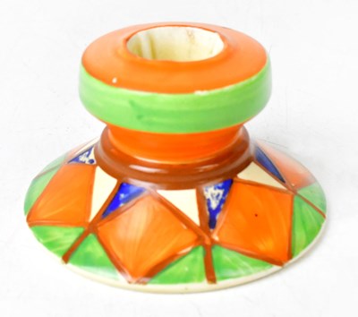 Lot 145 - CLARICE CLIFF; a Bizarre squat candlestick,...