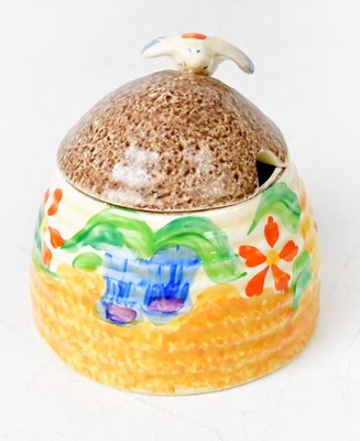 Lot 144 - CLARICE CLIFF; a Bizarre beehive honey pot,...