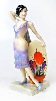Lot 92 - CARLTON WARE; a figure of Clarice Cliff 'The...