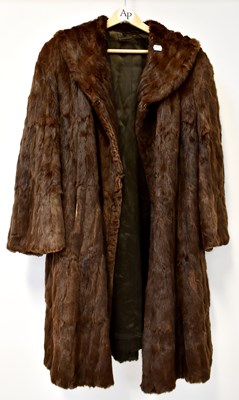 Lot 649 - A three-quarter length brown fur coat with...
