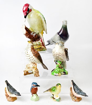 Lot 114 - BESWICK; eight models of birds, comprising...
