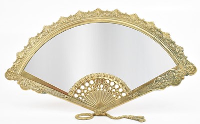 Lot 344 - A brass mirror in the form of a fan, 22 x 39cm.