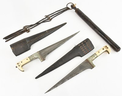 Lot 1332 - A pair of kabz daggers, in leather scabbards,...