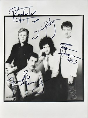 Lot 313 - QUEEN; a black and white photograph, bearing...