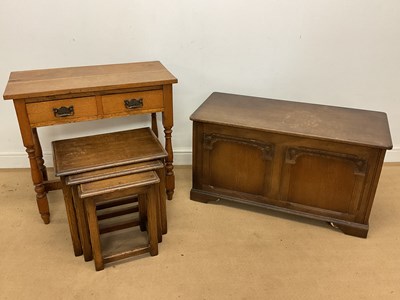 Lot 847 - An oak nest of tables, together with an oak...