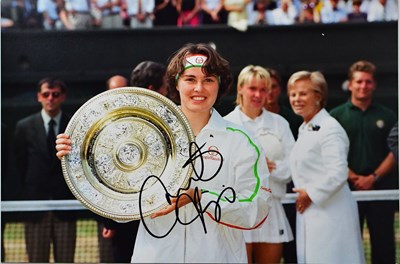 Lot 574 - MARTINA HINGIS; four signed colour photographs...