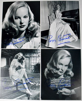 Lot 384 - PEGGY CUMMINS; four signed black and white...