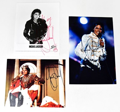 Lot 311 - MICHAEL JACKSON; two signed colour photographs,...