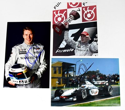 Lot 593 - MIKA HÄKKINEN; three signed colour photographs...