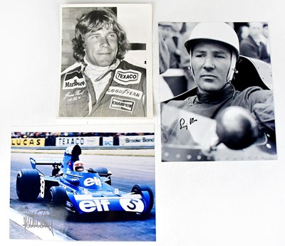 Lot 596 - JACKIE STEWART; a signed colour photograph,...