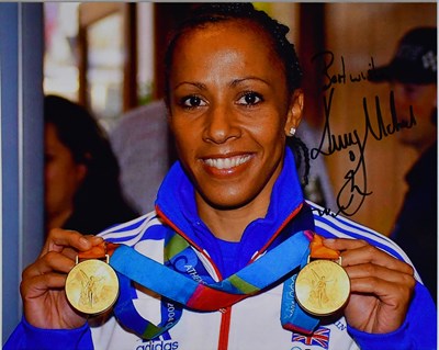 Lot 635 - KELLY HOLMES; three signed colour photographs...