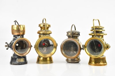 Lot 420 - Four vintage brass bicycle lamps, including a...