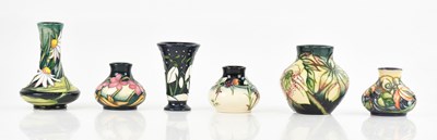 Lot 1578 - MOORCROFT; six small and miniature vases of...