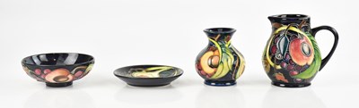 Lot 1581 - EMMA BOSSONS FOR MOORCROFT; four pieces...