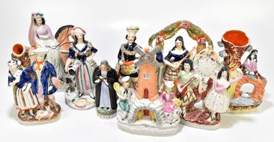 Lot 429 - STAFFORDSHIRE; a collection of nine 19th century and later flat back figures