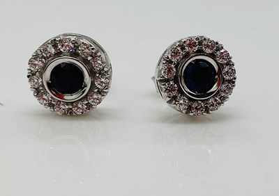Lot 776 - A pair of 18ct white gold sapphire and diamond...