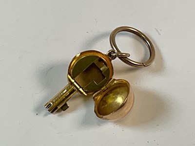 Lot 781 - A very unusual yellow metal orb, enclosing a...