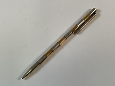 Lot 786 - GUCCI; a vintage two-tone propelling pencil,...