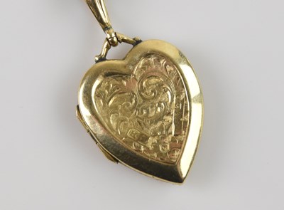Lot 2081 - A 9ct yellow gold love heart shaped pendant,...