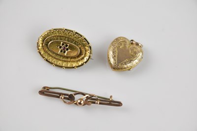 Lot 1306 - A Victorian yellow metal bar brooch, stamped...