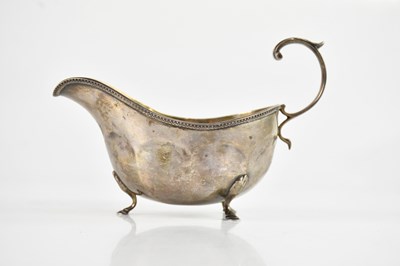 Lot 297 - A George V hallmarked silver sauceboat,...