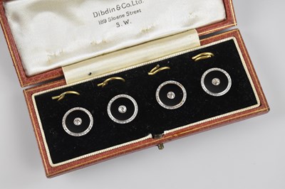 Lot 1451 - A set of four 18ct yellow gold and platinum...