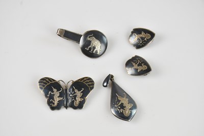 Lot 1078 - SIAM SILVER; a sterling silver and niello...
