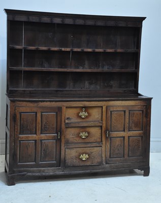 Lot 177 - An 18th century oak Welsh dresser with boarded...