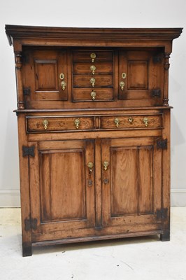 Lot 175 - An 18th century inlaid oak court cupboard with...