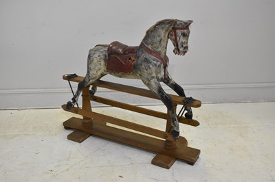 Lot 410 - A late 19th century painted wooden rocking...