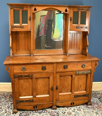 Lot 3003 - An Arts and Crafts oak sideboard, the raised...