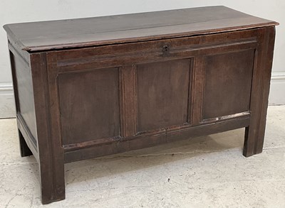 Lot 41 - An 18th century carved and panelled oak coffer,...