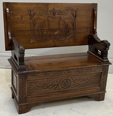 Lot 207 - A 1940s carved oak monk's bench, height 70 cm,...