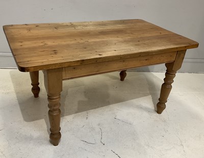 Lot 77 - A pine kitchen table, height 77cm, width 152cm,...