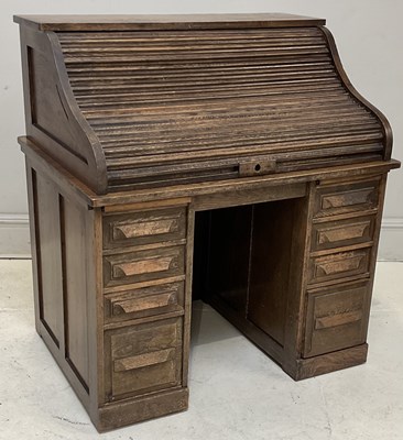 Lot 226 - BUTLER; a 1920s oak roll top desk with an...