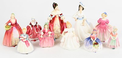 Lot 486 - ROYAL DOULTON; a group of ten figures to...