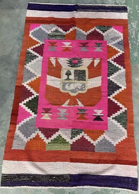Lot 715 - A hand woven Peruvian rug with South American...