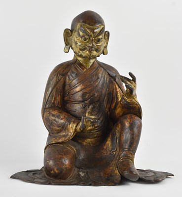 Lot 1023 - A 19th century Chinese gilt bronze figure of...