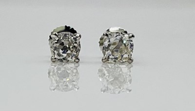 Lot 791 - A pair of 18ct white gold and diamond ear...