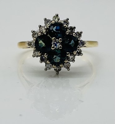 Lot 792 - An 18ct yellow gold diamond and sapphire...