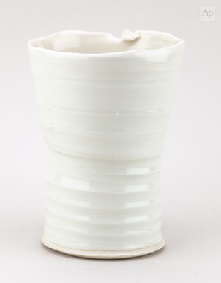 Lot 757 - A porcelain vessel with pronounced ribbing and...