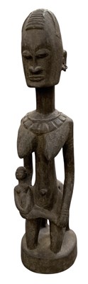 Lot 1018 - A West African carved wooden tribal Dogon...