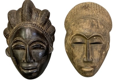 Lot 1015 - Two African carved wooden tribal masks,...